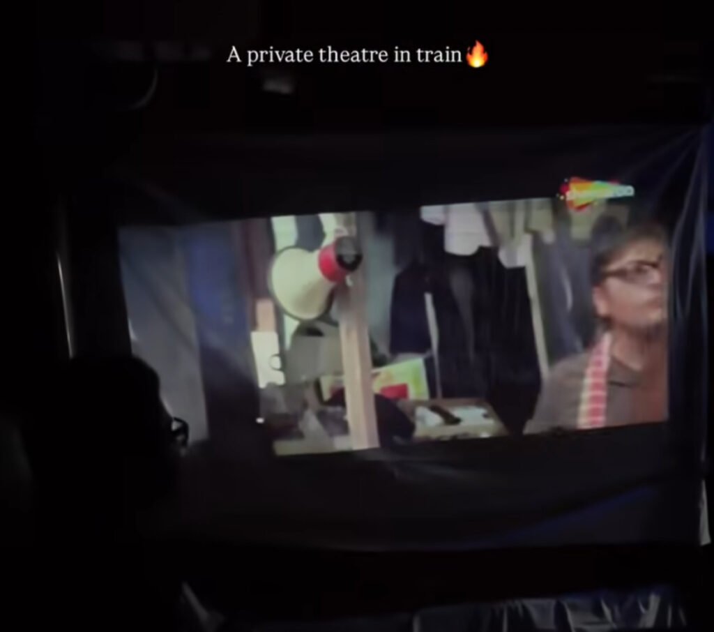 Office Team Turns Train Compartment Into Mobile Cinema – Video Goes Viral With Projector and Popcorn Office Team Turns Train Compartment Into Mobile Cinema – Video Goes Viral With Projector and Popcorn